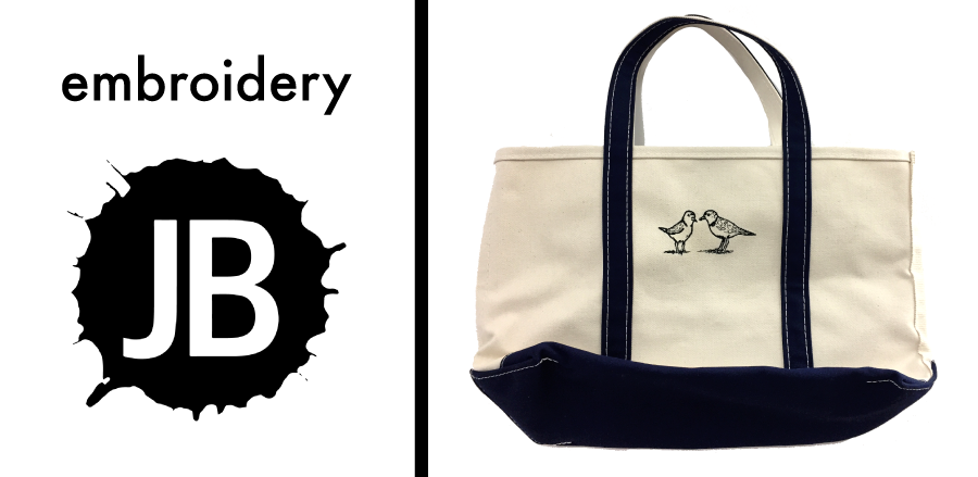 Small bird logo embroidery on a canvas tote bag