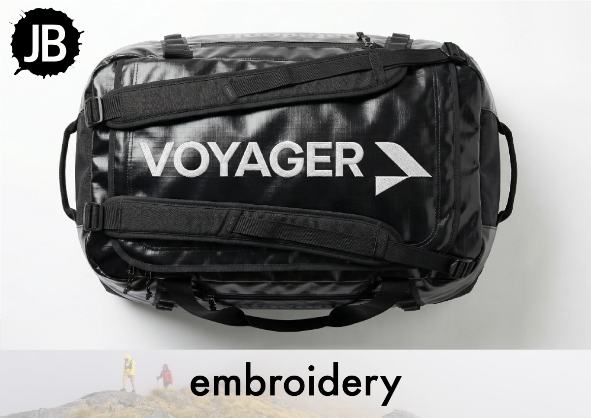 Large embroidered logo on a black travel bag showing bag embroidery capabilities