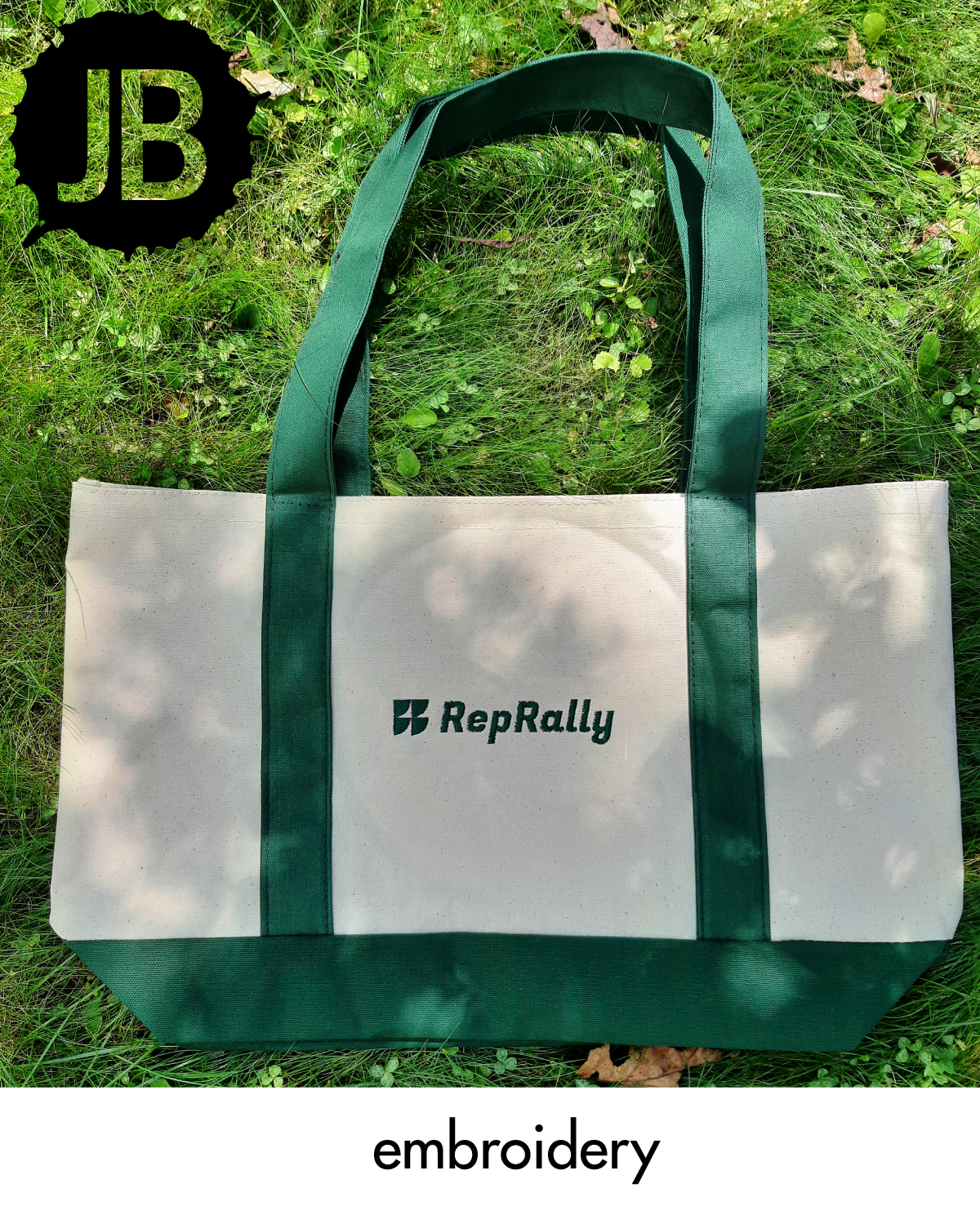 Embroidered logo tote bag with green handles for a branded project