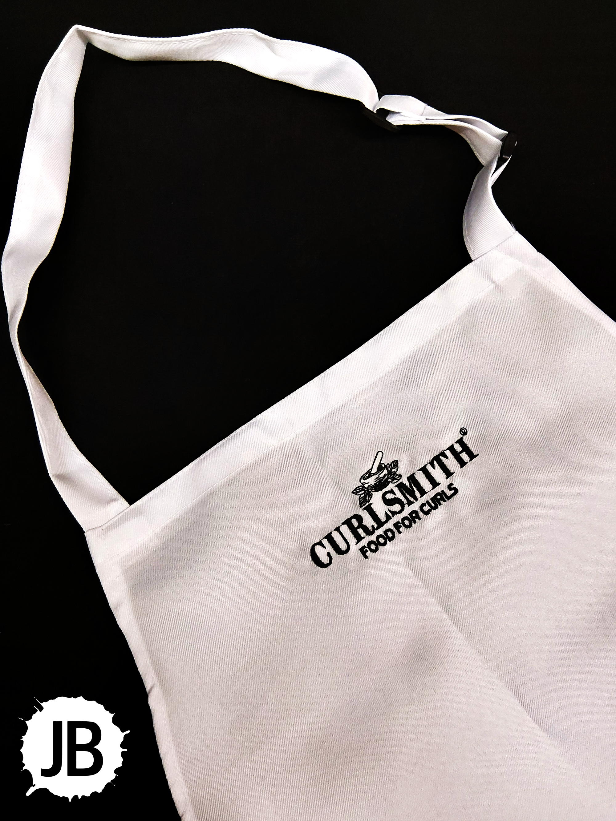 Syntus adjustable black bib apron with two front pockets
